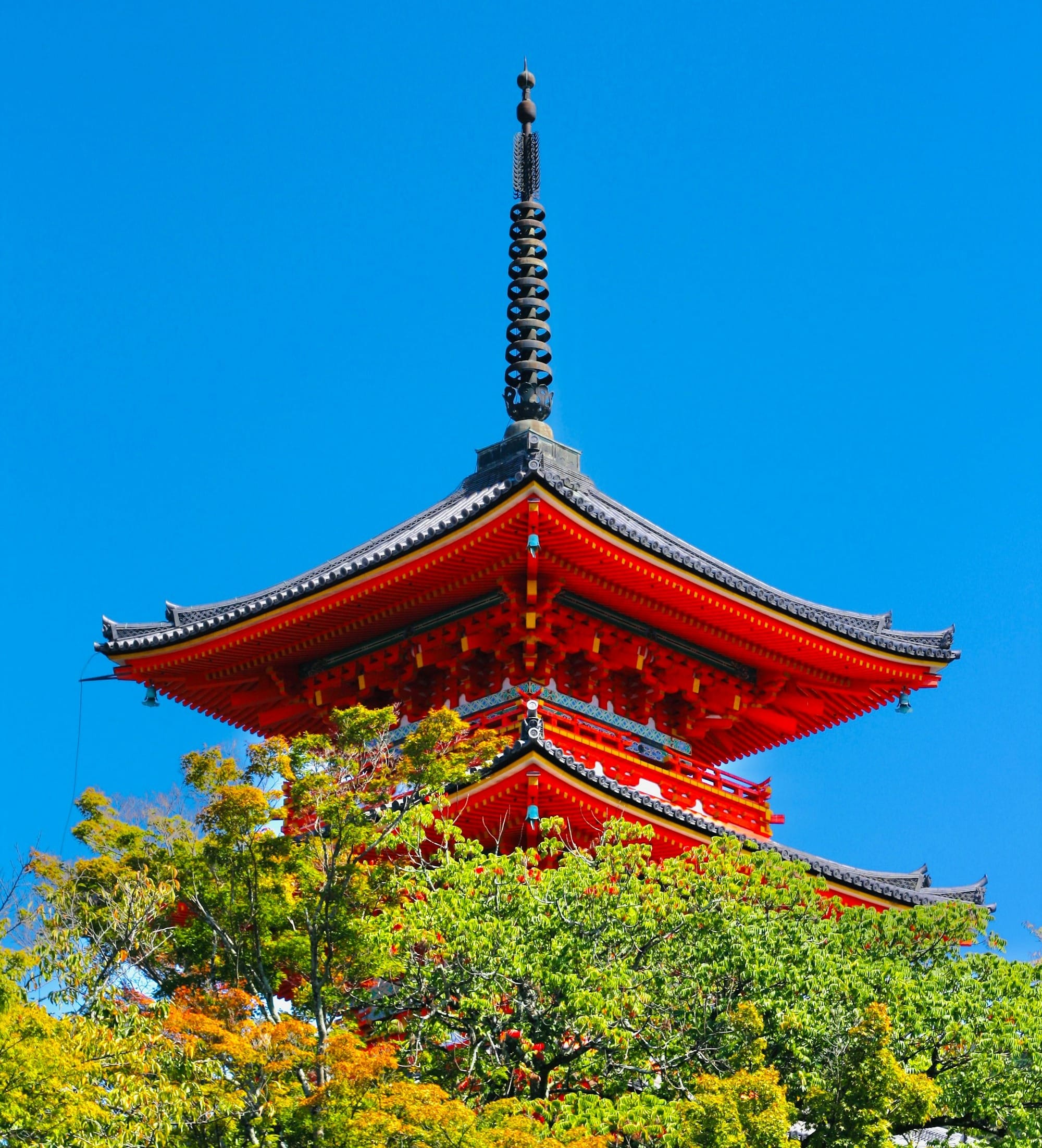 The vivid red pagoda of Kiyomizu-dera Temple in Kyoto — a stunning blend of color, craftsmanship, and centuries-old architectural grace