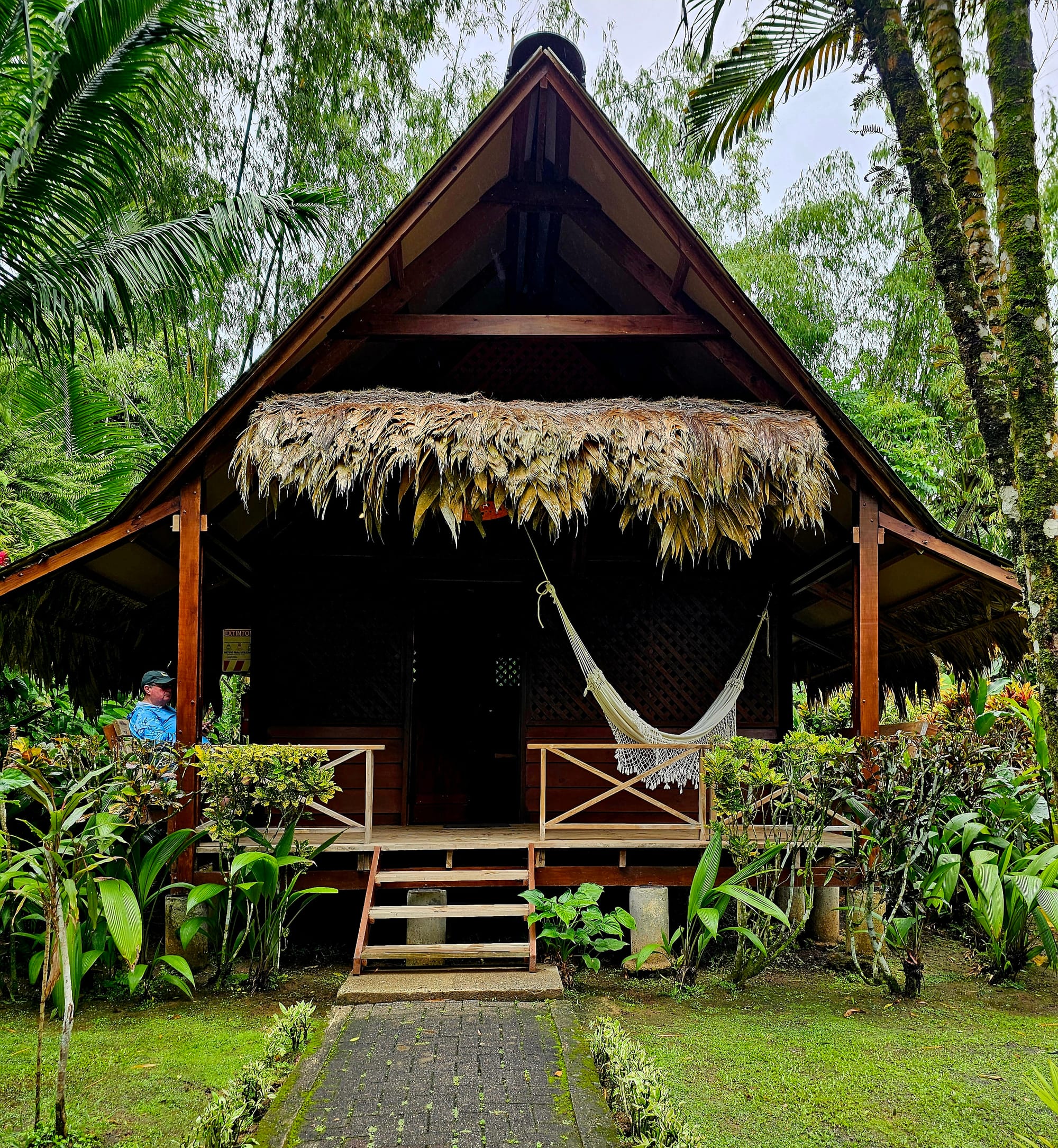 Our jungle bungalow in Cahuita—open-air living beneath a thatched roof, surrounded by rainforest, birdsong, and the slow rhythm of Caribbean coastal life.