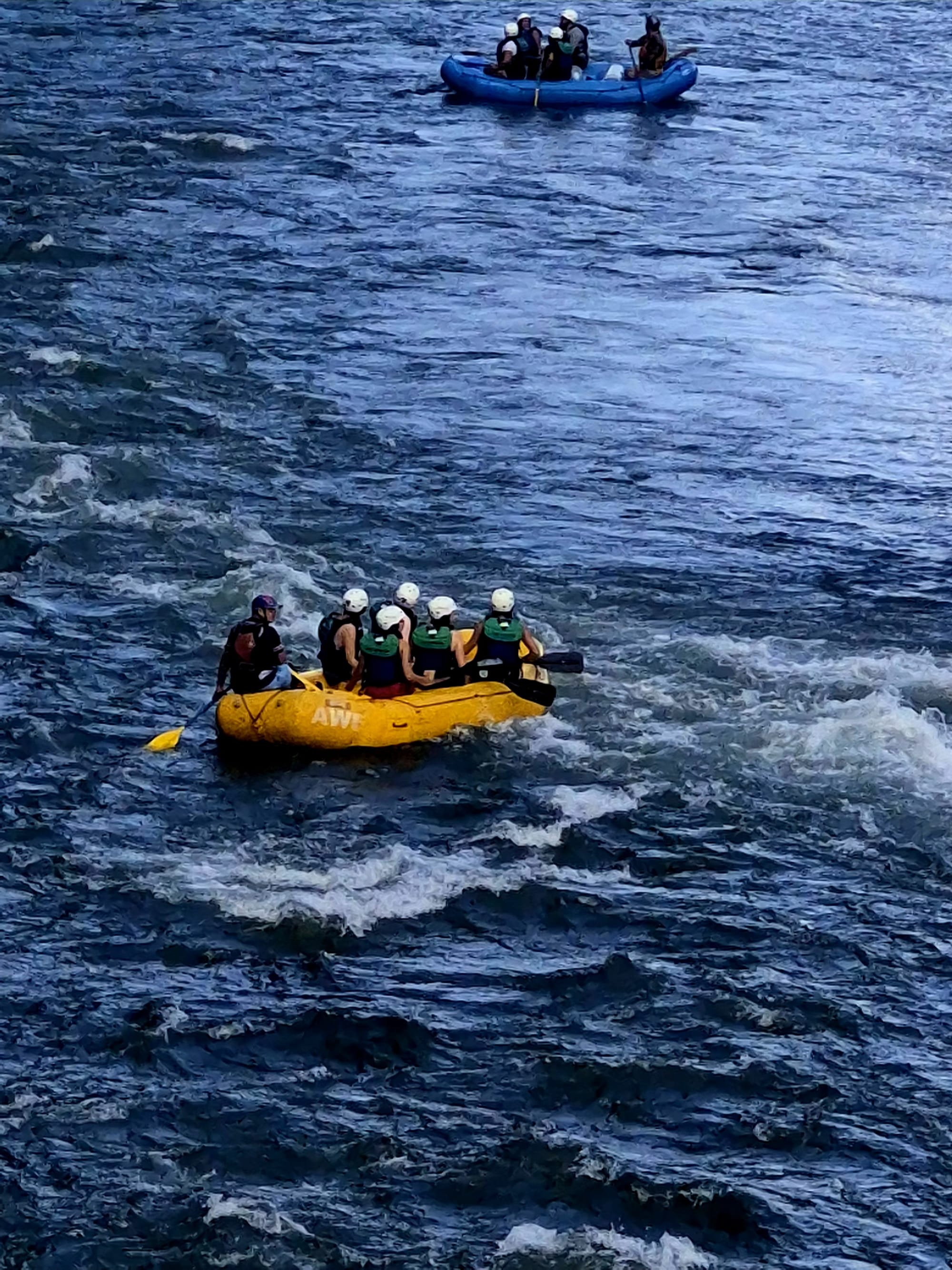 Rafters on the Sarapiquí River seen from the suspension bridge above.
