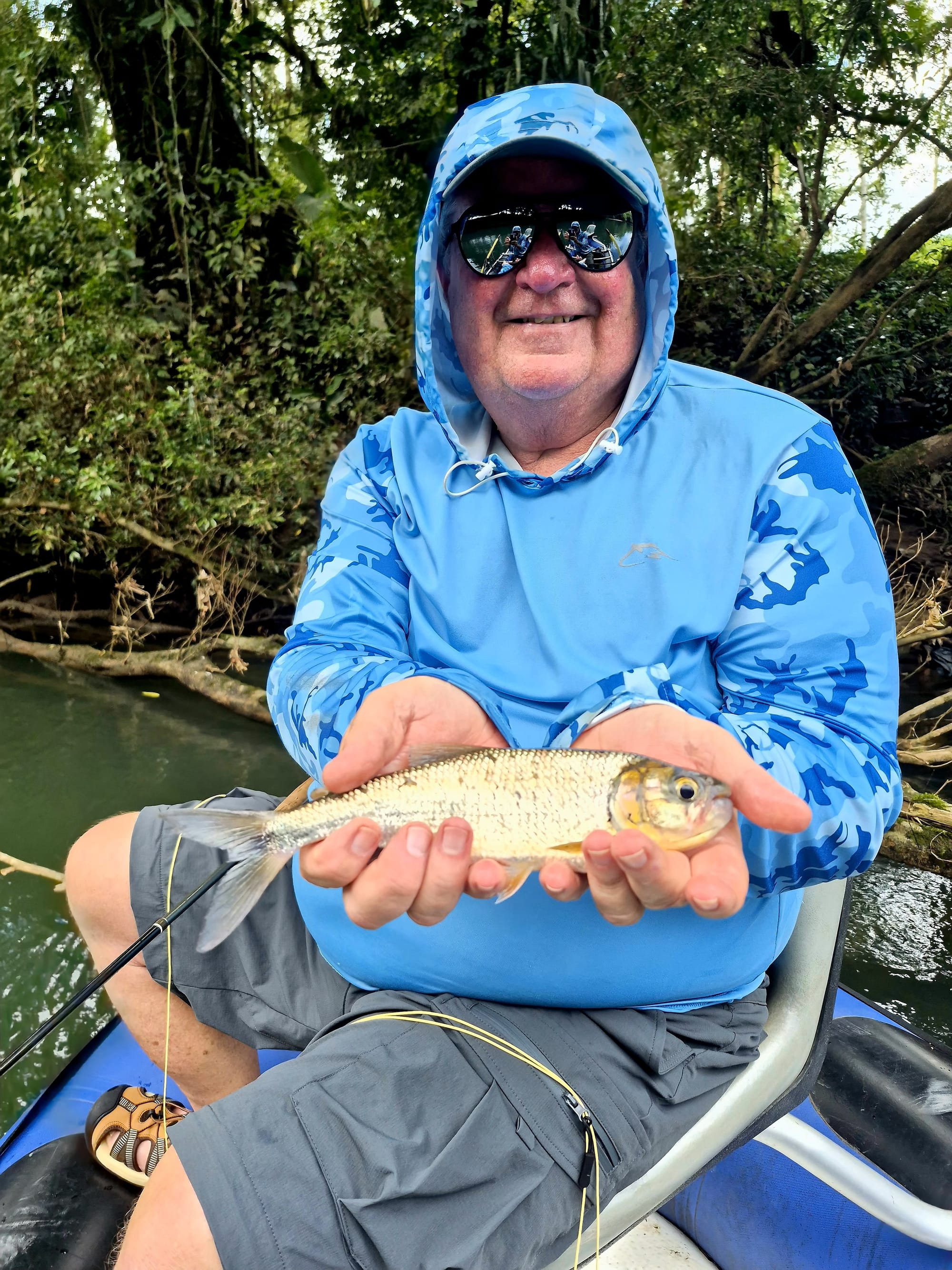 First machaca caught on the Sarapiquí River — Costa Rica jungle fishing success.