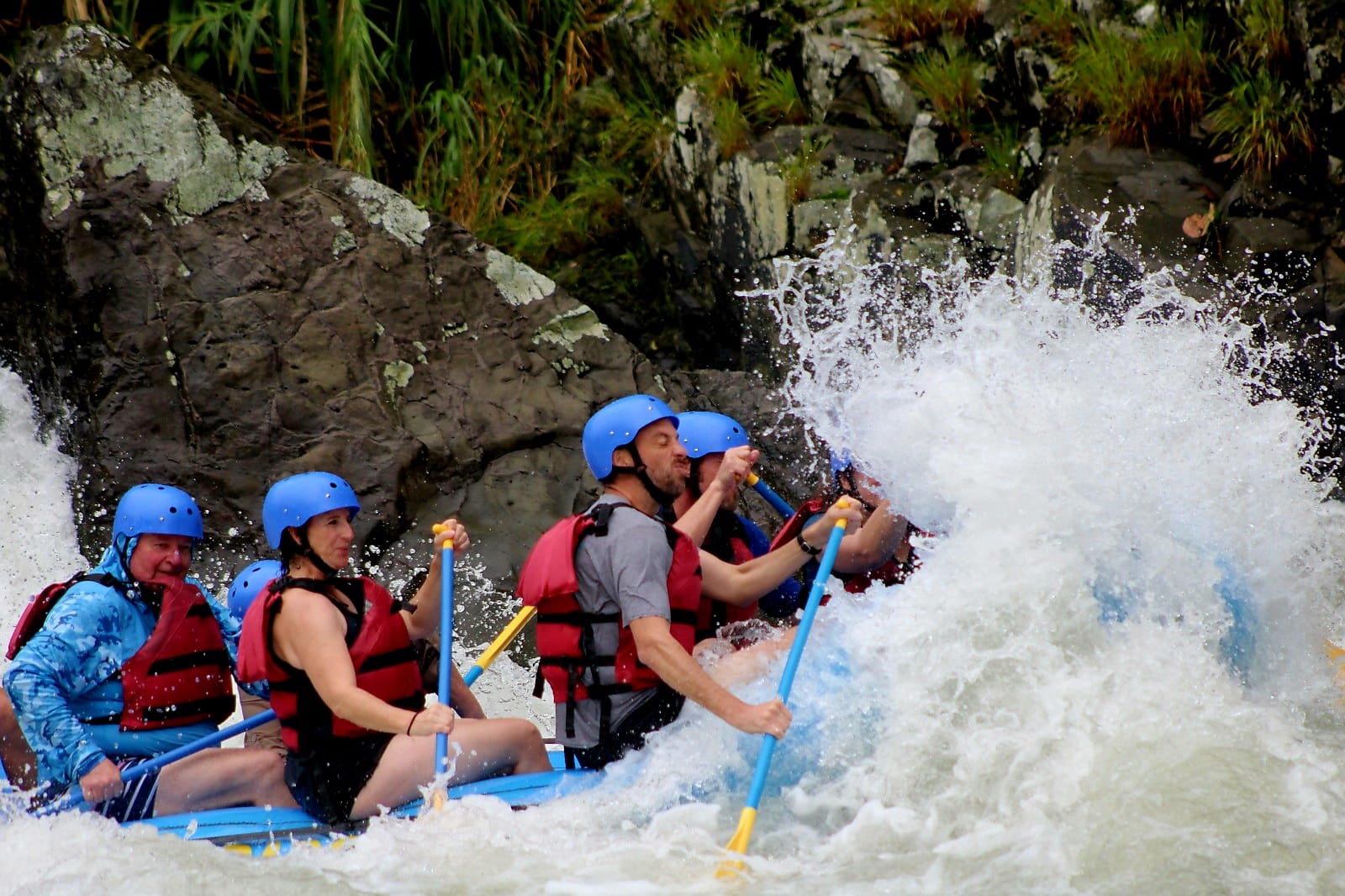 A clean hit through a standing wave, water pouring straight over the bow.